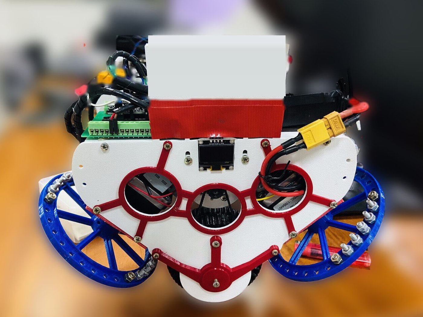 Front view of my dual reaction wheel unicycle robot with OLED display and blue reaction wheels